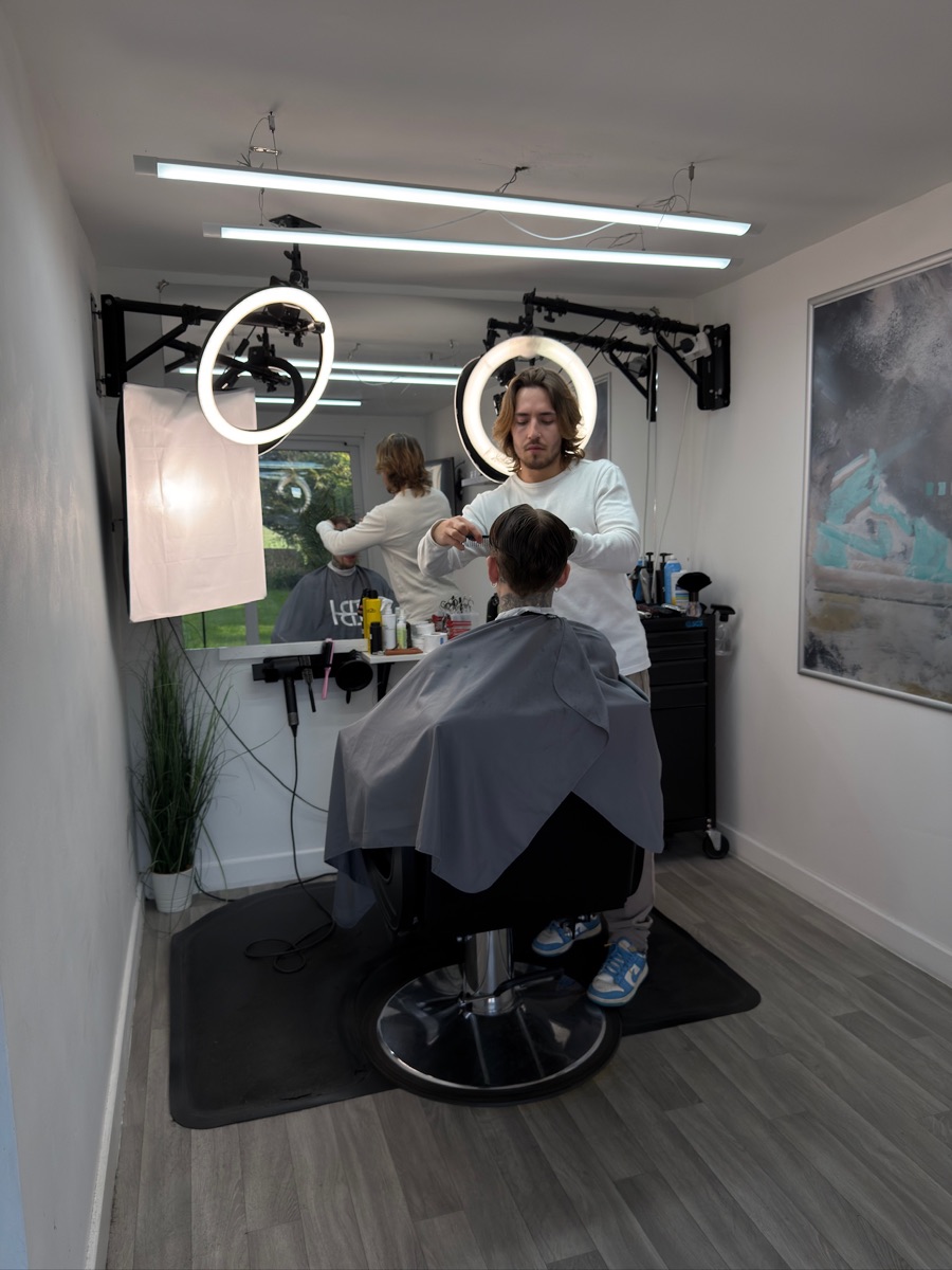 A barber cutting a client's hair